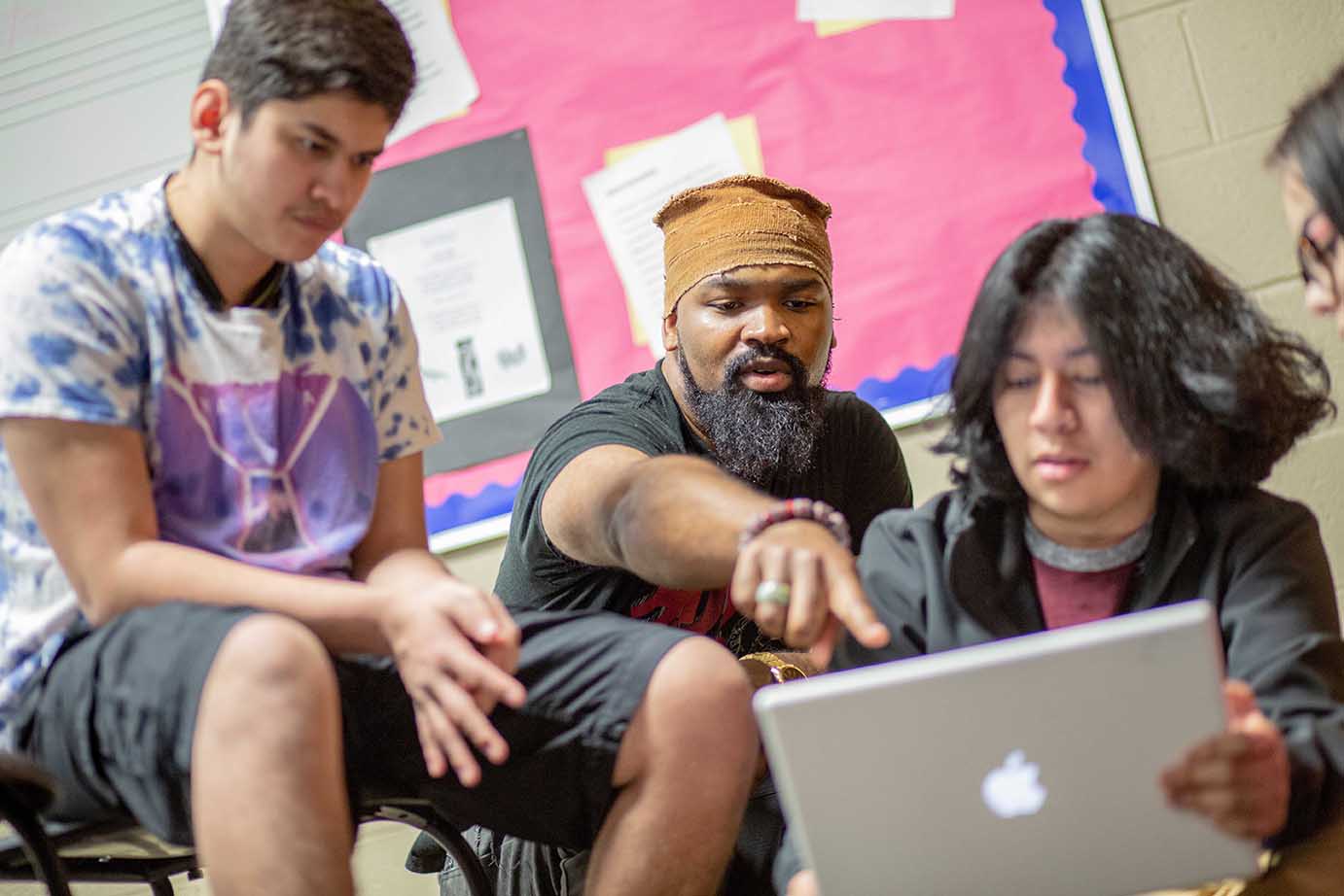  Man with 2 students